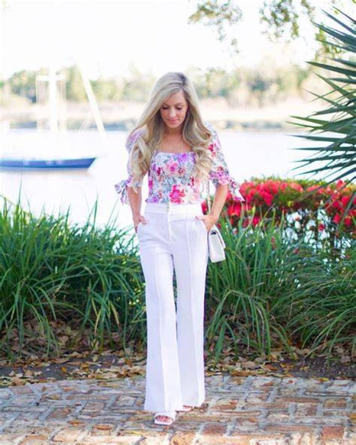 White pants & floral blouse at Nicole Miller Spring 2016
