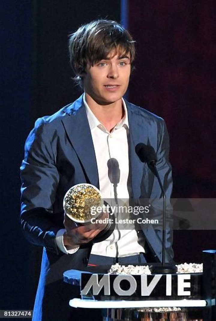 Zac Efron accepts the award for best shirtless performance for That Awkward Moment on stage at the MTV Movie Awards, at Nokia Theatre in Los Angeles 2014 MTV Movie Awards - Show, Los Angeles, USA - 13 Apr 2014
